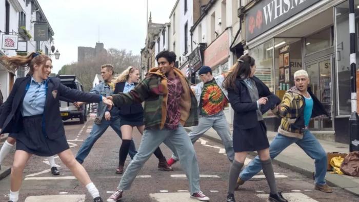 Greatest Days: A group of people dance in the street