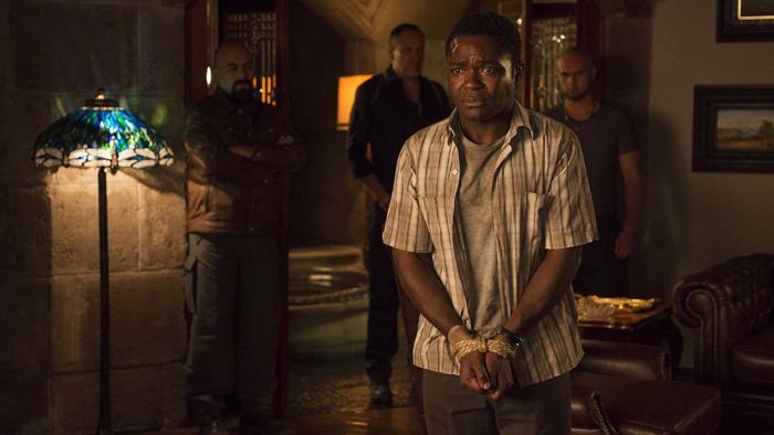 Gringo Movie: Harold, looking scared, with his hands tied