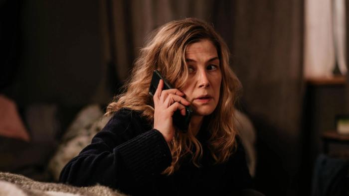 Hallow Road: Rosamund Pike looks panicked as she holds a phone to her ear