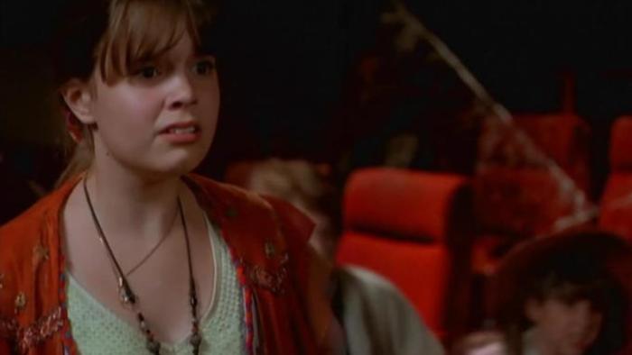 Halloweentown Movie: A blonde teen girl looks distraught inside a movie theater with red seats