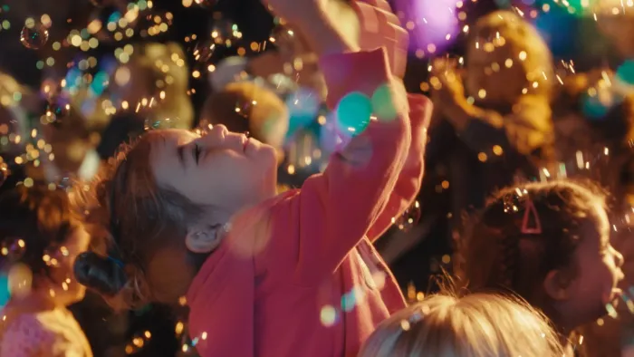 Happy and You Know It: A child plays in bubbles.