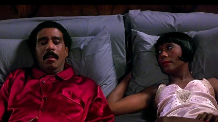 Harlem Nights: Richard Pryor and Berlinda Tolbert lying in bed together.