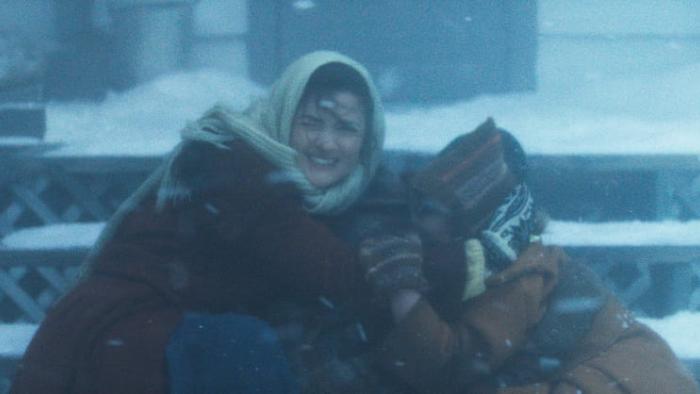 Hazel's Heart movie:  Madelyn Dundon huddles on the school steps holding Xavier and Genevieve Bielinski