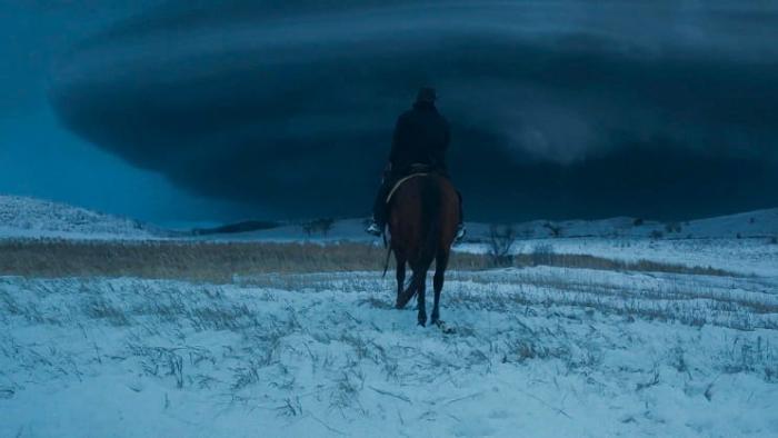 Hazel's Heart movie: Stelio Savante rides a horse towards a black cloud ahead