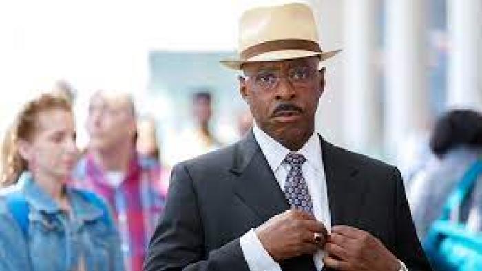 Heist 88: A Black man walks in a crowd