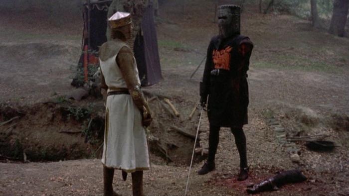 Monty Python and the Holy Grail Movie: Two knights in British medieval armor face off