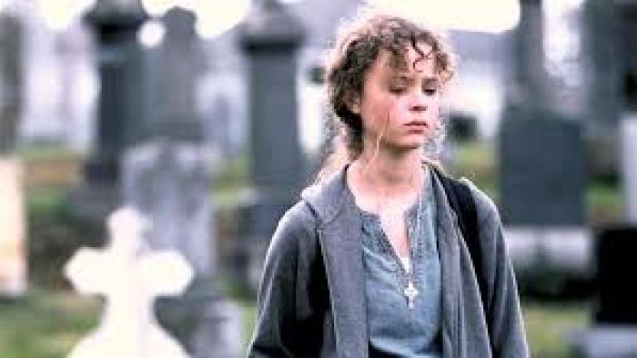 Homeless to Harvard: The Liz Murray Story: Thora Birch looks sad in cemetery