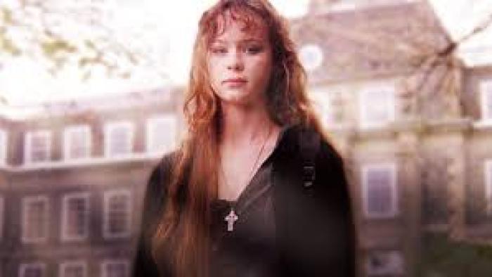 Homeless to Harvard: The Liz Murray Story: Thora Birch looks pensive in front of building