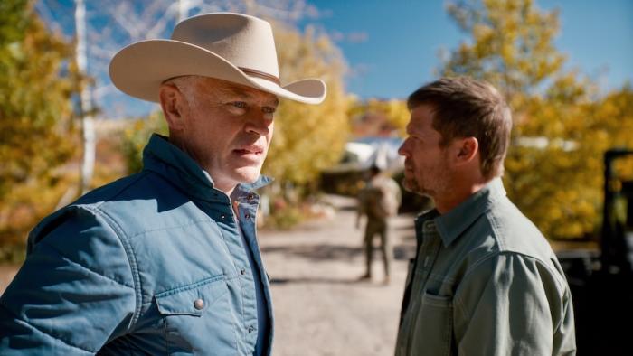 Homestead Movie: In the compound, Ian Ross (Neal McDonough) and Jeff Eriksson (Bailey Chase) discuss something serious