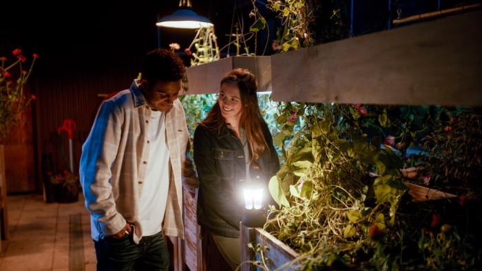 Homestead Movie: Abe (Tyler Lofton) and Claire (Olivia Sanabia) smile and talk in the greenhouse late one night