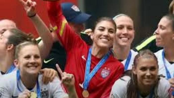 Untold Hope Solo: Hope Solo with medal and teammates