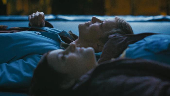 Horsegirls movie: Margarita (Lilian Carrier) and Sandy (Gretchen Mol) lie next to each other on the ground