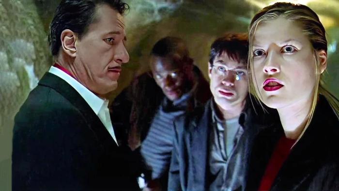 House on Haunted Hill: Steven, Eddie, Pritchett, and Melissa in a dark tunnel looking intently in different directions.