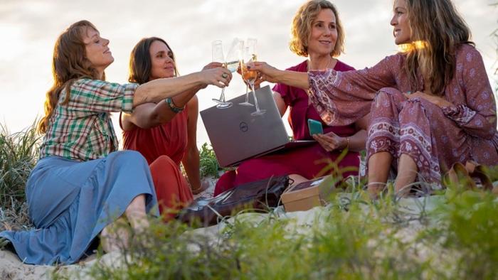 How to Please a Woman: Four ladies raising a glass
