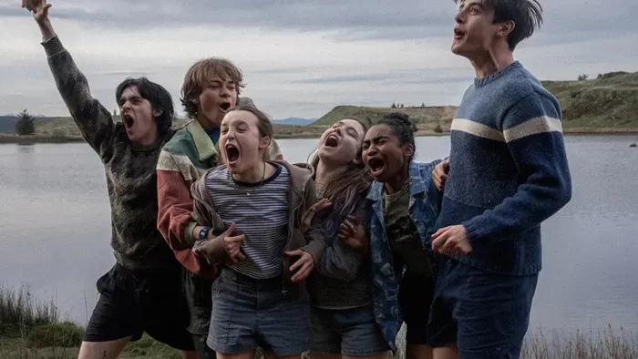 Sunny Dancer: Group of six teens by a lake, excitedly shouting