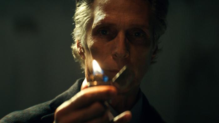Hypnotic Movie: A sinister-looking Dellrayne (William Fichtner) holds up a lit lighter