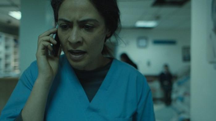 I Was a Stranger movie: Yasmine Al Massri works in a hospital and calls someone on a cell phone 
