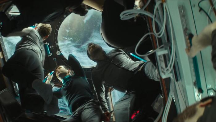 I.S.S. Movie: Astronauts and cosmonauts move through a passageway on the space shuttle