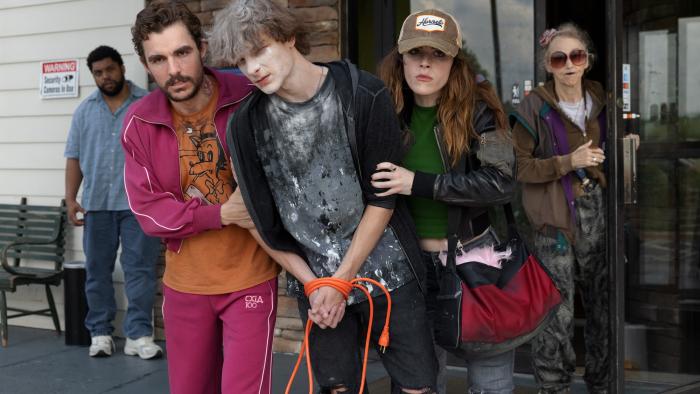 Idiots movie: Dave Franco and Kiernan Shipka flank Mason Thames, who's covered in powder, wrists zip tied