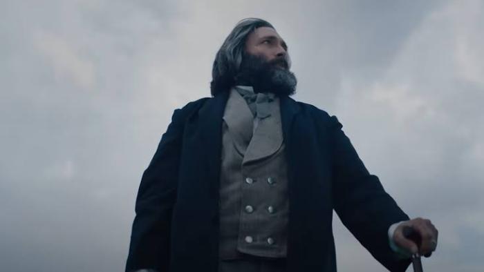 I Heard the Bells movie: Man in period attire gazes into distance against a cloudy sky.
