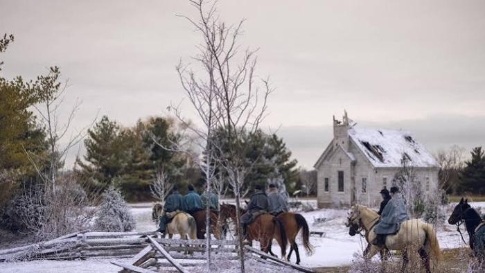 I Heard the Bells movie: Riders on horseback in snowy countryside near a small house.