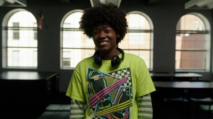 Immutable movie: Madison, a Black female student of the Washington Urban Debate League smiles 
