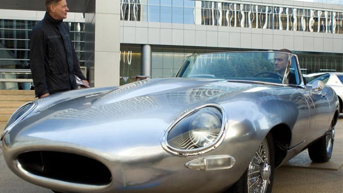 Will Salas driving a luxurious gray car.
