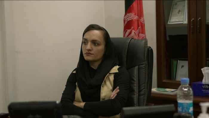 Zarifa Ghafari seated in an office.