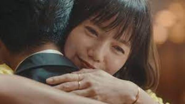 In Love and Deep Water: Asian woman happily embraces a man