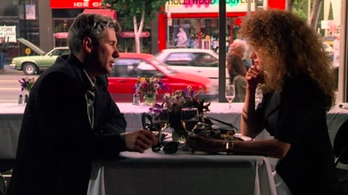 Internal Affairs: Richard Gere and Nancy Travis having dinner in a restaurant.