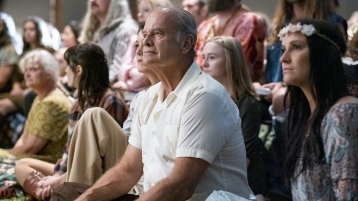 Jesus Revolution Movie: Kelsey Grammer sits on the floor alongside Flower Children of the late 1960s