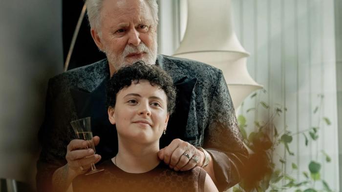 Jimpa: John Lithgow puts his hands on Aud Mason-Hyde's shoulders from behind as they both smile