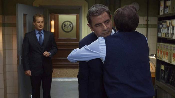 Johnny English Strikes Again Movie: Bough hugs Johnny English as Pegasus watches on