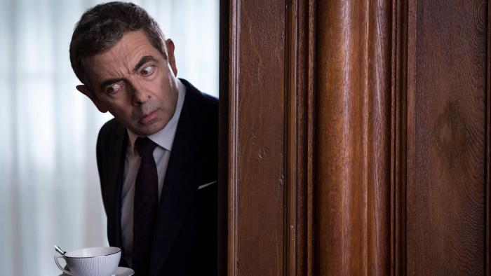 Johnny English Strikes Again Movie: Johnny English listens around a corner