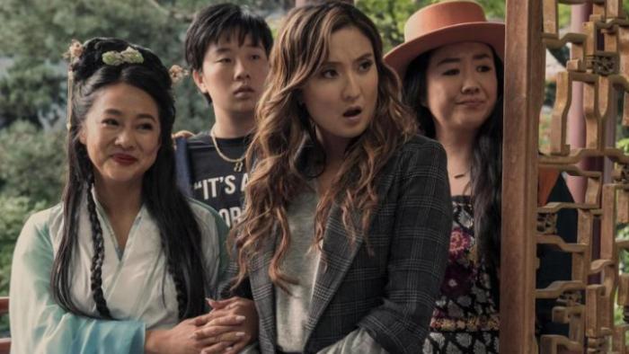 Joy Ride: Four Asian women are standing together and shown from the waist up. One wears a traditional Chinese dress and another looks quizzically at something off-camera. 