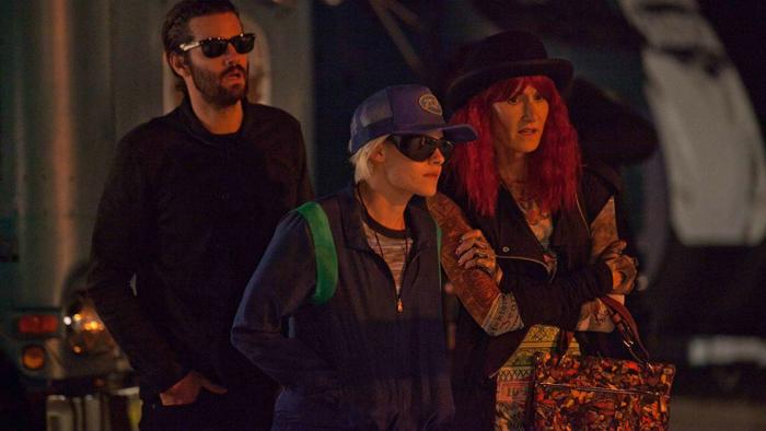 J.T. LeRoy Movie: Savannah, Laura, and Geoffrey wear sunglasses and cluster together in front of a building