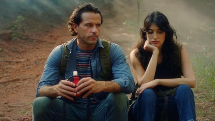 The Adventures of Jurassic Pet: Return to the Wild: A man and woman sit side by side with frustrated looks on their faces