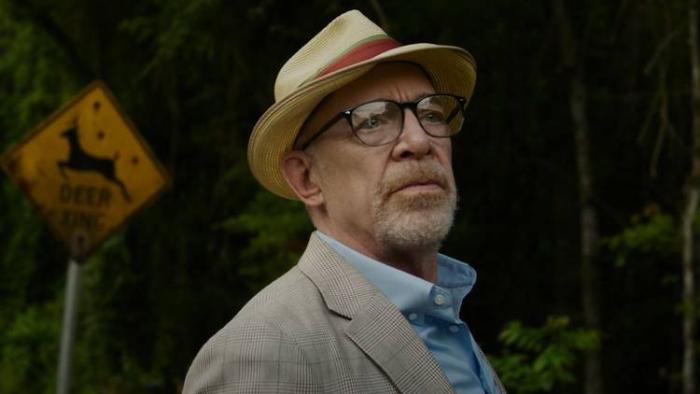 Juror #2 Movie: Juror Harold (J.K. Simmons) stands in front of a "Deer Xing" sign