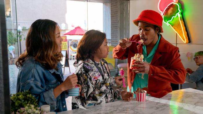 K-POPS! movie: Anderson .Paak eats ice cream, with Jee Young Han and Soul Rasheed smiling at him