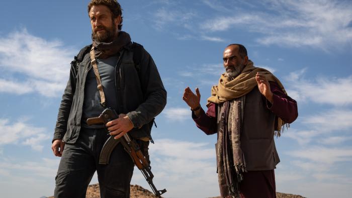 Kandahar Movie: Tom and Mo look down at something from a ridge