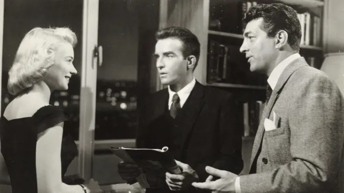 The Young Lions: Montgomery Clift and Dean Martin conversing with a female friend