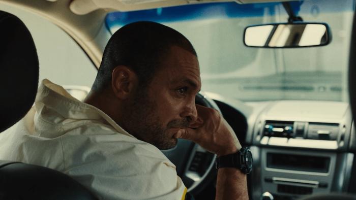 King Ivory Movie: Drug lord Ramón Garza (Michael Mando) sits in a car and looks at something out the passenger window