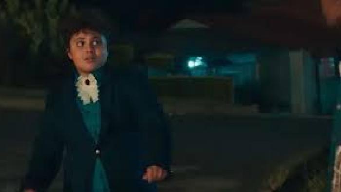 Kings of Mulberry Street: Let Love Reign: An Indian South African boy in dark suit, blue shirt, and white lapel left dances