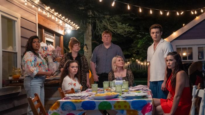 Kissing Is the Easy Part movie: A backyard celebration is interrupted, with everyone looking at something off camera