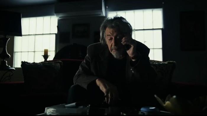 Knox Goes Away Movie: Knox's friend Xavier (Al Pacino), sitting in a darkened room on a sofa, speaks on the phone