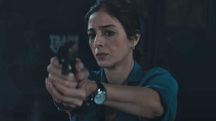Kuttey: Pammi with gun. 