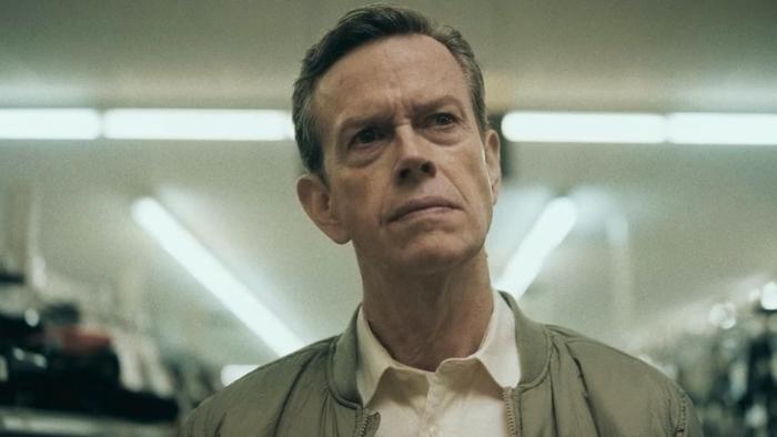LaRoy, Texas: Dylan Baker looks angry in a brightly lit store