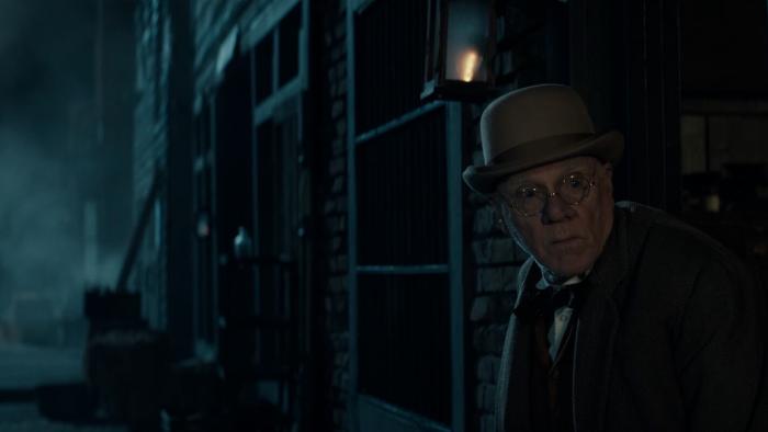 Last Train to Fortune Movie: At night, Cecil pokes his head out of a prison door, looking furtively around