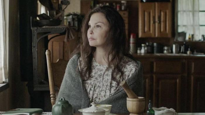 Lazareth movie: Ashley Judd sits at a kitchen table, shawl around her shoulders