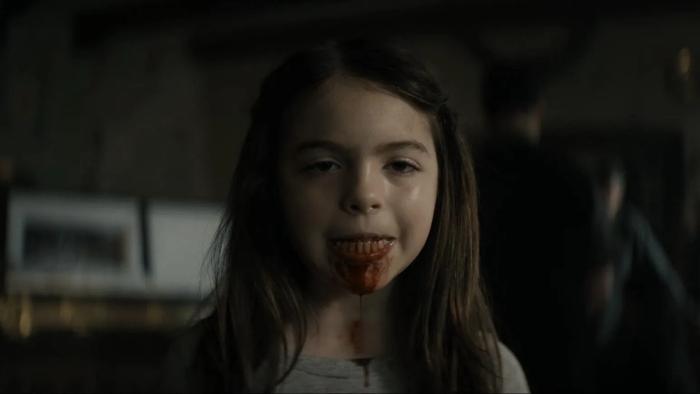 Lee Cronin's The Mummy movie: A young girl looks into the camera, blood in her mouth